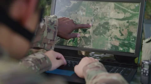 Military Members Looking at a Map on a Computer 스톡 동영상 208791353
