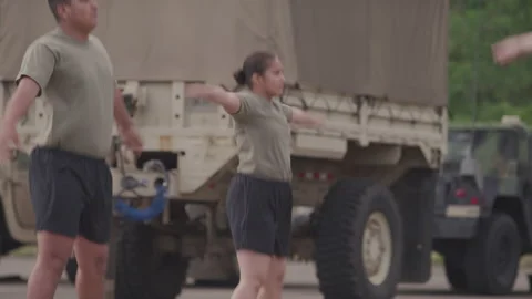 Military Members Training with Jumping Jacks on Base Stock Footage 208782830