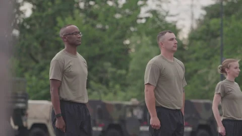 Military Members Waiting for Their Command to Start Jumping Jacks Stock Footage 208783302