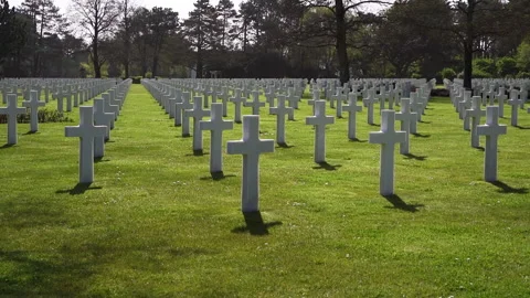 Military memorial cemetery with repeating rows of white grave markers Stock Footage 335085002