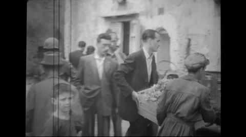Military men and people loading a cart Stock Footage 39887632