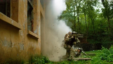 Military men falling after explosion, slow motion Stock Footage 86458061