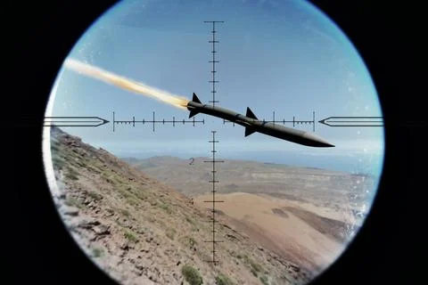 Military missile in optical scope flies over mountains with flame trail. Stock Photos