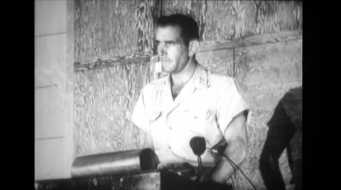 Military officer talking on microphone while standing at podium Stock Footage
