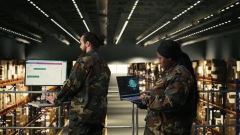 Military officer using AI-powered tools in warehouse at military base Stock Footage 330204967