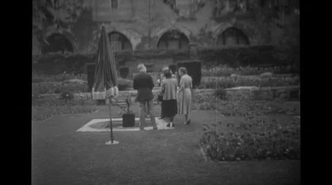 Military officers and women standing in the lawn Stock Footage