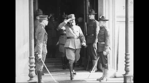 Military officers coming out of embassy Stock Footage