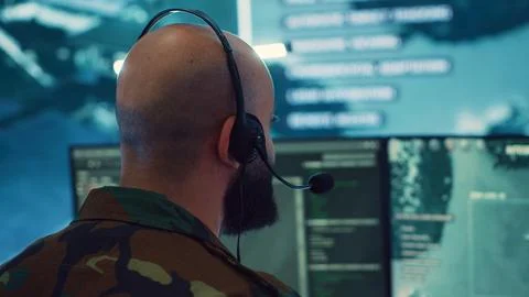 Military operator transmitting gps coordinates of hostile ships to national Stock Photos