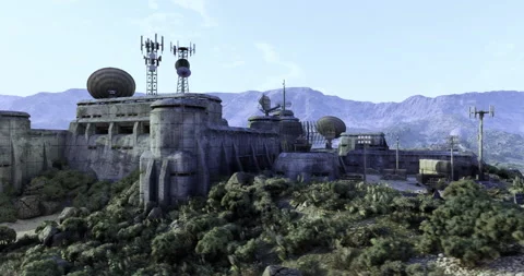 Military outpost surrounded by mountains and vegetation in remote area Stock Footage 305695853