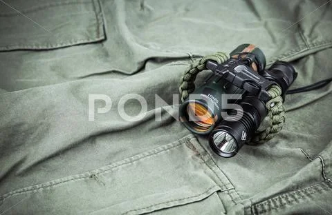 Military paracord bracelet, tactical torch and spy-glass Stock Photos