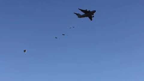 Military paratroopers exiting of C-17 Gl... | Stock Video | Pond5