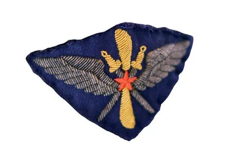 Military patch with winged dagger and star symbol on dark blue fabric USSR... Stock Photos