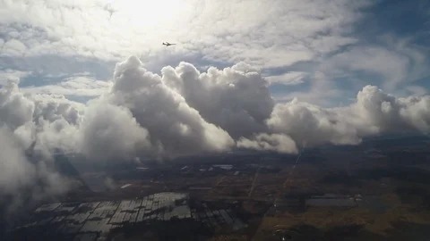 A military plane on a background of clouds Stock Footage 69995124