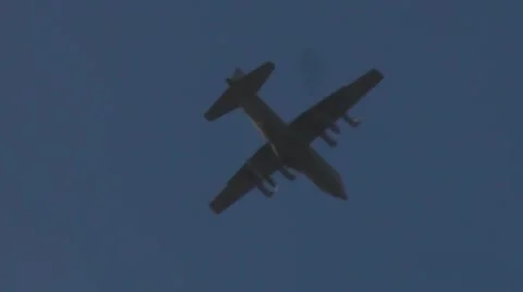 Military Plane disappears into cloud Stock Footage