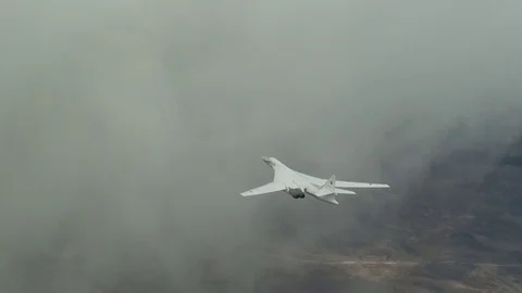 Military plane flying through the clouds Video stock 70823090