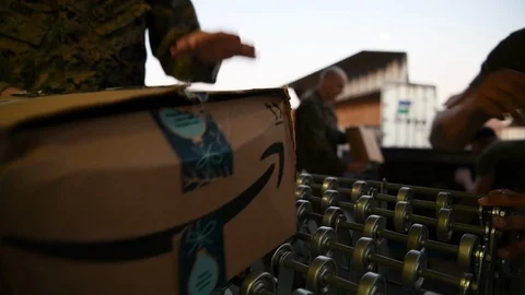 Military postal workers loading parcels onto conveyor Stock Footage 122211226