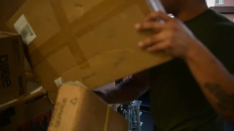 Military postal workers stacking parcels on conveyor 스톡 동영상 122210982