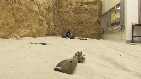Military robot handling unexploded bomb Stock-Footage 93522012