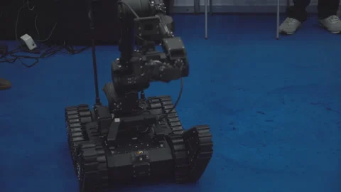 Military robot on remote control neutralizes bomb at robot festival. Video stock 206326936