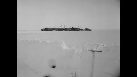 Military scientists check the density of the snow and radiation readings are Stock Footage