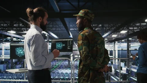 Military server room IT professionals using AI LLM tech on laptop Stock Footage 310787154