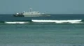 Military ship and tourists in paddle boat HD Footage