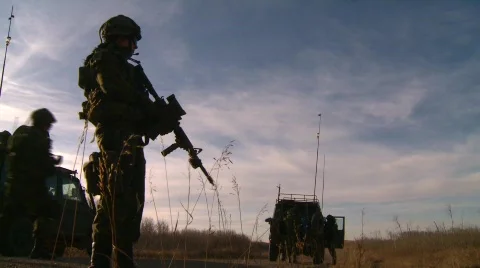Military, soldier and trucks, standing guard Stock Footage