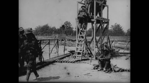 Military soldier climbing down steps of lookout tower Stock Footage 43313819