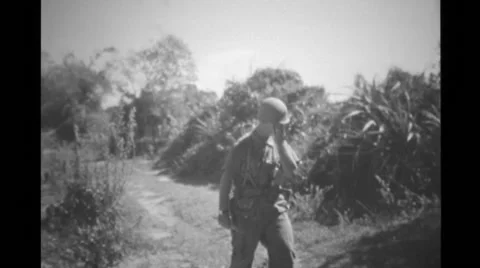 Military soldier searching punji trap Stock Footage
