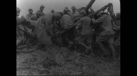 Military soldiers pushing a horse cart out of bog Stock Footage