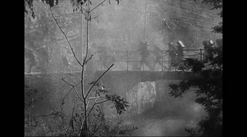 Military soldiers running on bridge while in combat Stock Footage 43321906