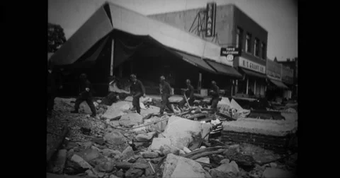 Military soldiers walking across ruined building Stock Footage