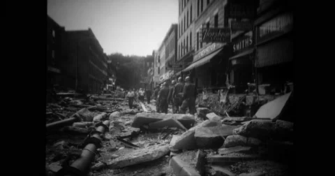 Military soldiers walking across ruined building Stock Footage