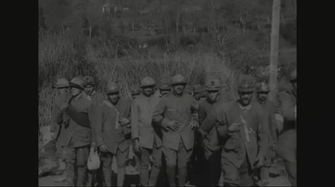 Military soldiers walking in a row Stock Footage