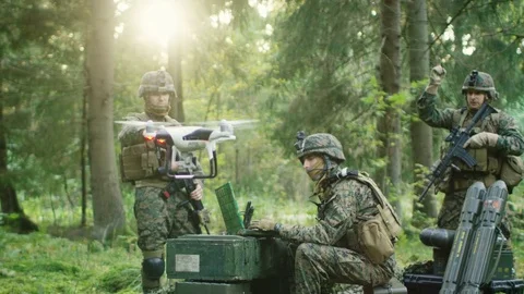 In the Military Staging Base Army Engineer and Soldiers Fly Military Grade Drone Stock Footage 82110598