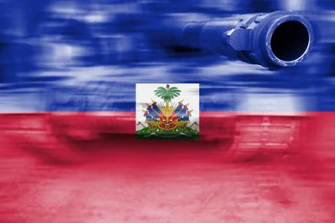 Military strength theme, motion blur tank with Haiti flag Foto stock