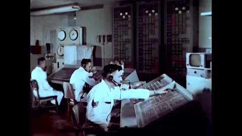 Military technicians man the mission control center of an Atlas ICBM Missile Stock Footage