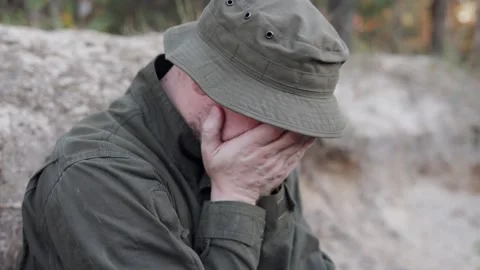 Military trainee experiences panic attack while in a foxhole during war drills. Stock Footage 326033758