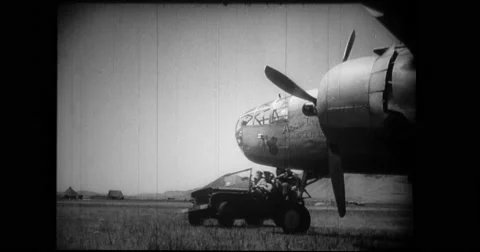 Military troop getting off from van to board B-25 Mitchell bomber Stock Footage