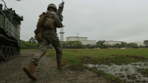 Military Troops Run Through Mud* Stock Footage 115120853