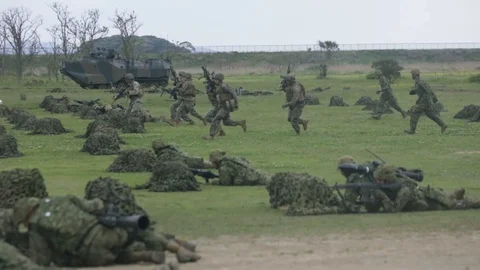 Military Troops Run While Others are Prone* Stock Footage 115121185