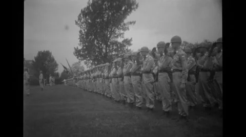 Military troops standing in a row and saluting Stock Footage