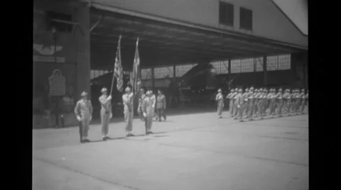 Military troops standing in a row and military officers marching behind Stock Footage 37594110