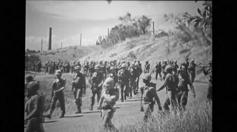 Military troops walking on road Stock Footage 37592053
