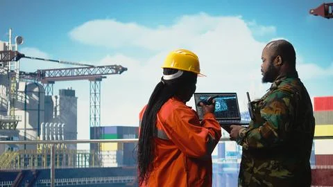 Military unit on offshore rig using AI automated counter terrorism systems Stock Photos