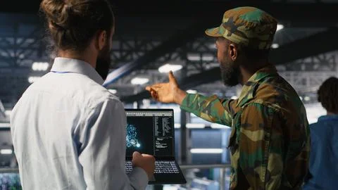 Military units in high tech server hub overseeing AI computing operations Stockfoto's