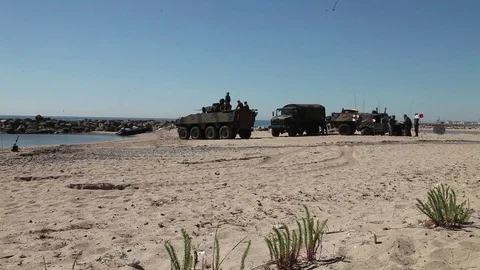 Military vehicles lined up on beech Stock-Footage 76289820