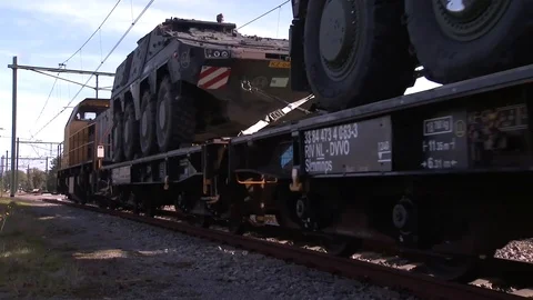 Military Vehicles Pass on a Flatbed Rail Car* Stock Footage 115121453