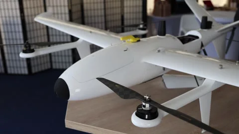 Military VTOL drone with fixed wings and rotors designed for long range reconnai Stock Footage 346451418