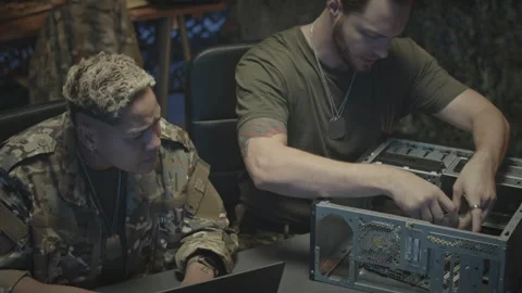 Military Workers Assembling Computer Processor at Night Stock Footage 262738184